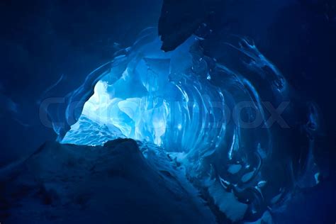 Blue Ice Cave Covered With Snow And Flooded With Light Stock Image