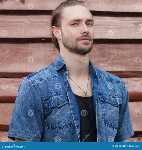 Portrait Of Handsome Young Man On Wooden Background Stock Image