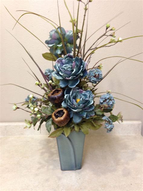 A Beautiful Group Of Flower Arrangements With Blue 454