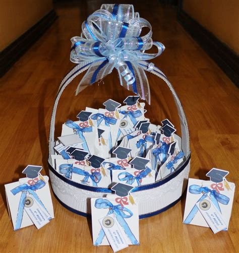 A Basket Filled With Graduation Decorations On Top Of A Wooden Floor