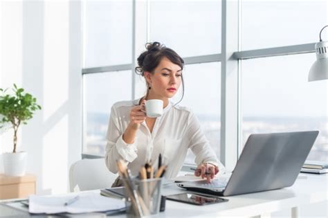 Business Woman Drinking Coffee Using Laptop Stock Photo Free Download
