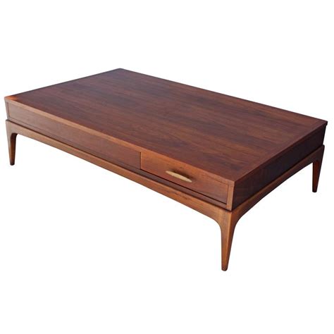 Can you give me any information on this item such as a date, type of wood & possible value. Mid-Century Lane Modern Coffee Table For Sale at 1stdibs