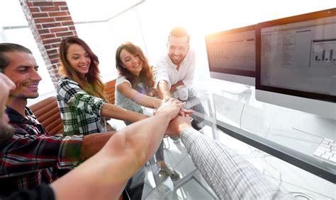 Creative Business Team Putting Hands Together At The Office Stock Image