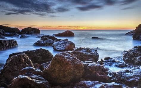 Sunrise Over The Sea And Rocky Shore Stock Image Image Of Clouds