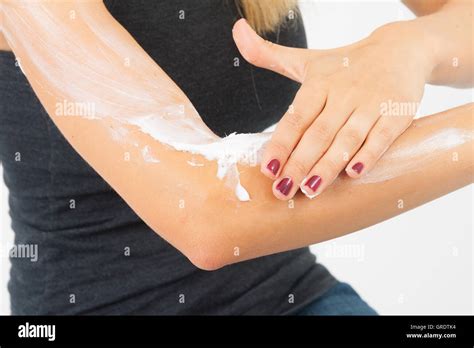 Woman Putting Lotion On Arm Hi Res Stock Photography And Images Alamy