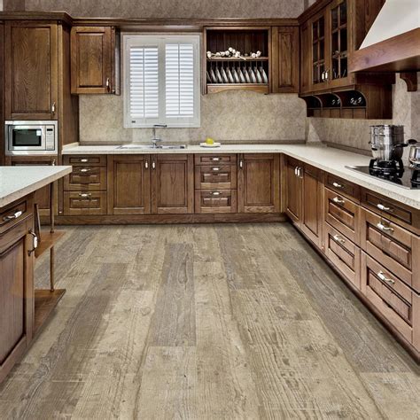 It is certainly possible to install vinyl planks under kitchen cabinets, but this is only possible if you are installing the cabinets at the same time, or if you are able to remove your cabinets. LifeProof Amherst Oak 8.7 in. x 72 in. Luxury Vinyl Plank ...