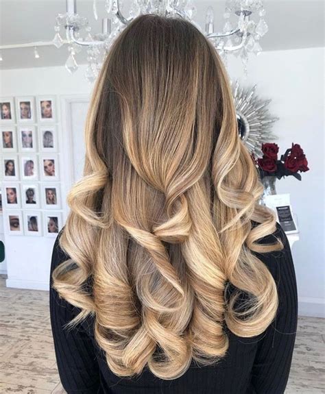 Beautiful Two Toned Blonde Hair With Dark Roots Styled With A Bouncy Curly Blow Dry Full Of