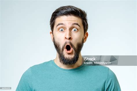 Man With Shocked Amazed Expression Isolated On Gray Background Stock
