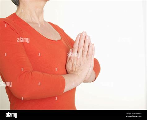 Senior Woman In Prayer Position Stock Photo Alamy
