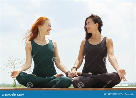 Two Women Doing Yoga Outdoors Yoga Instructor Shows Poses Stock Photo