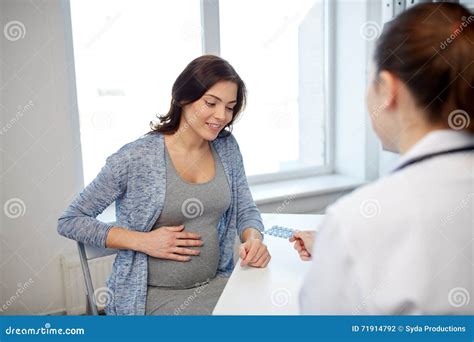 Gynecologist Doctor And Pregnant Woman At Hospital Stock Photo Image