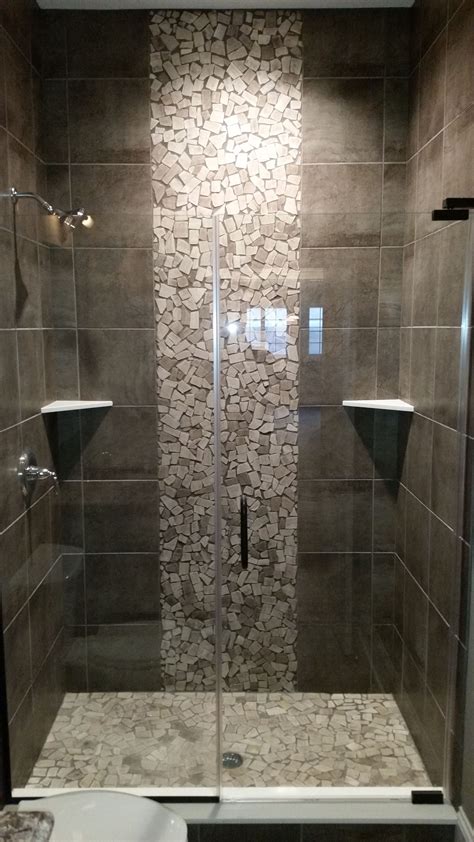 Like any other bathroom, you also have to consider the associate interiors. Pebble Tile Walk In Shower | Bathroom remodel shower ...