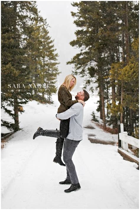 Winter Engagement Session In The Mountains Lift Kiss Pose Snow