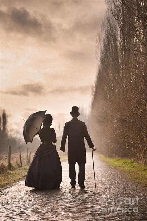 Victorian Man And Woman Walking On A Cobbled Avenue Photograph By Lee