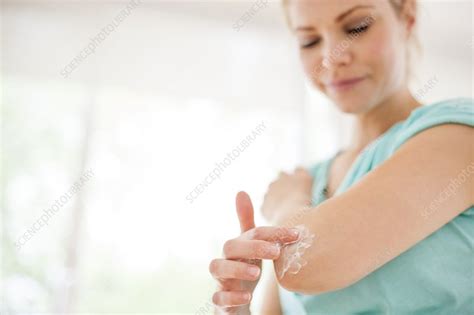 Woman Applying Body Lotion Stock Image F008 3034 Science Photo Library