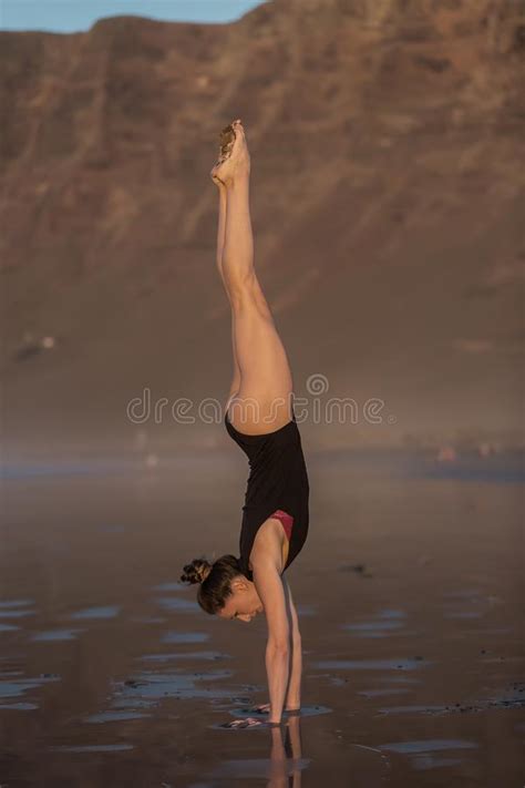 Woman In Handstand On Wet Sandy Beach Stock Image Image Of Freedom