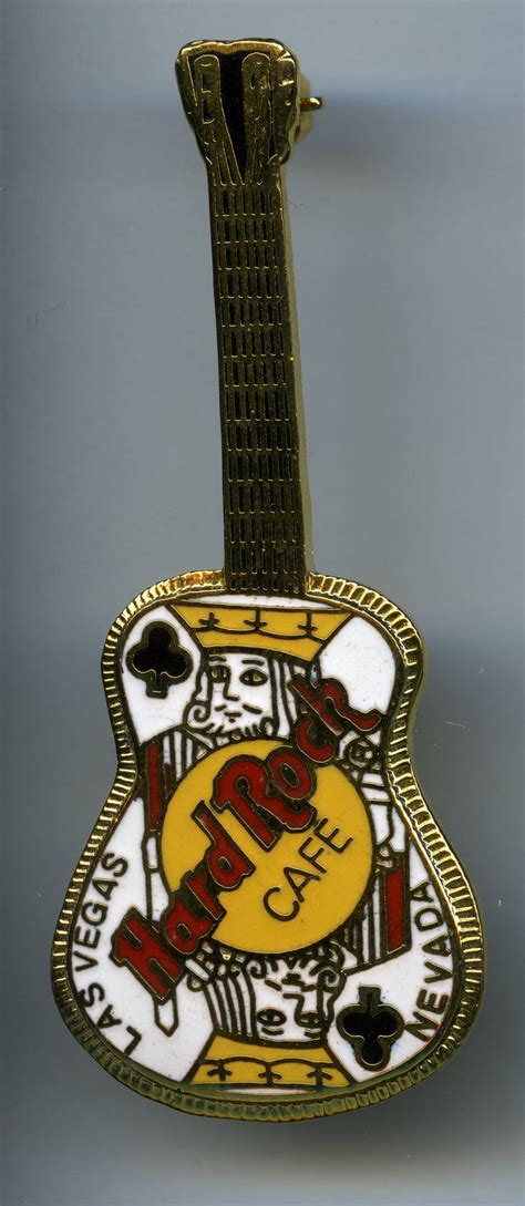 A Guitar Shaped Pin With The Words Rock And Roll On It