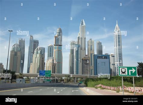 Driving On Sheikh Zayed Road With A View Of The Dubai Marina Skyline