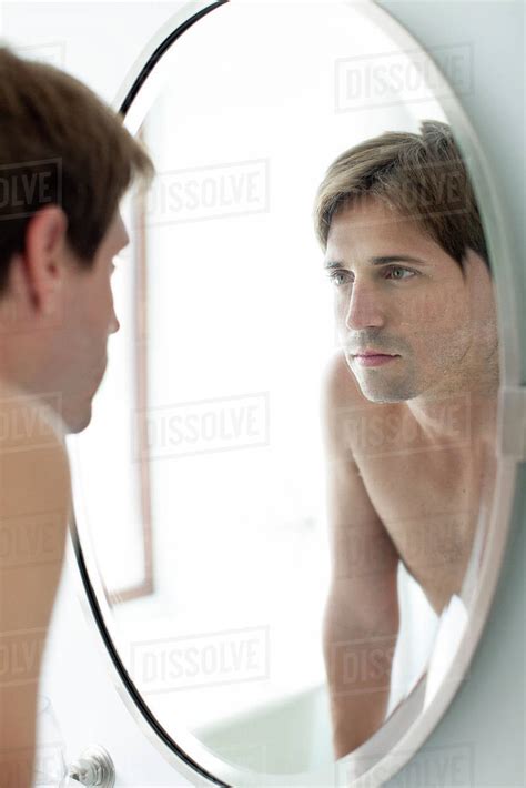 Man Looking At Self In Mirror Stock Photo Dissolve