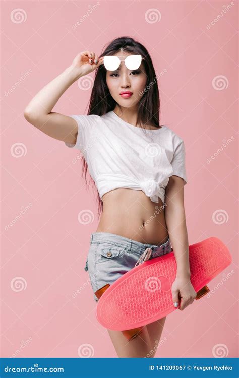 Beautiful Asian Woman In Sunglasses With Skateboard Stock Image Image Of Positive Pink 141209067