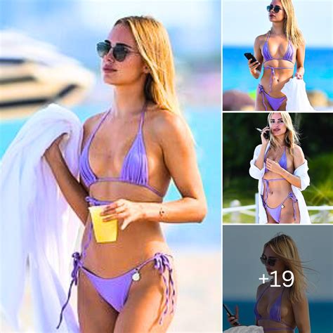 Kimberley Garner Shows Off Her Toned Abs Sexy And Peachy Posterior In A Plunging Purple Bikini