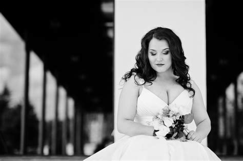 premium photo close up portrait of big breasts brunette bride with wedding bouquet posed at
