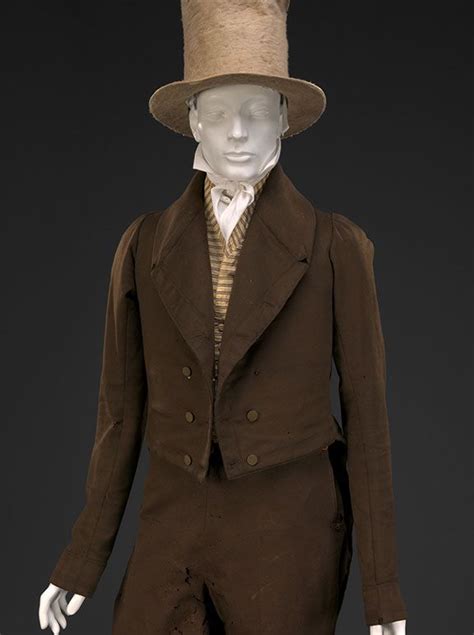 A Mannequin Wearing A Brown Suit And Hat