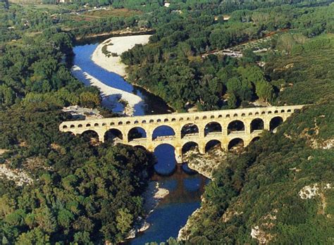 The pont du gard is an ancient roman aqueduct bridge built in the first century ad to carry water over 50 km to the roman colony of nemausus.4 it crosses the river gardon near the town of the pont du gard is the highest of all roman aqueduct bridges, as well as one of the best preserved. Pin by Bonnie Frederick on Dream Destinations | Nimes ...
