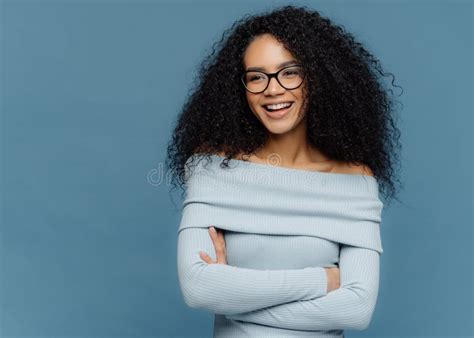 Portrait Of Serious Beautiful Dark Skinned Female With Frizzy Black
