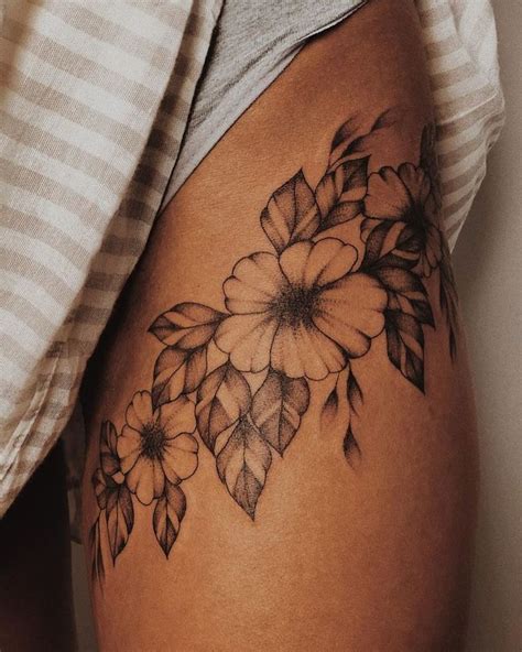 A Woman S Thigh With Flowers On It