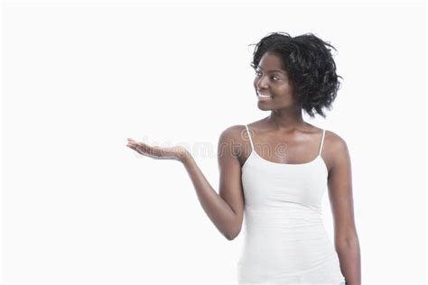 Happy African American Young Woman Holding His Palm Out Over White