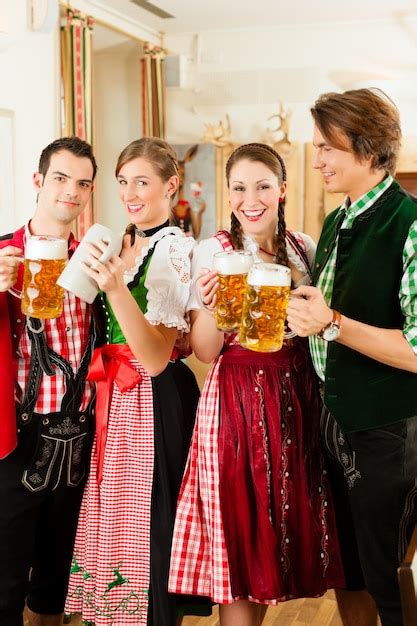 Premium Photo Young People In Traditional Bavarian Tracht In