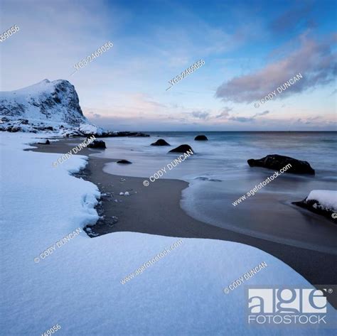 Snow Covered Myrland Beach In Winter Flakstadøy Lofoten Islands
