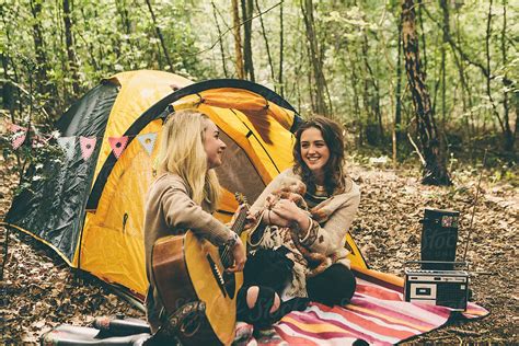 Two Teenage Girls Camping In Woodland Del Colaborador De Stocksy Kkgas Stocksy