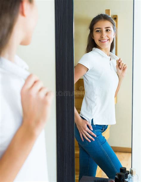 Young Girl Trying On A T Shirt Stock Image Image Of Reflection Adult 70408707