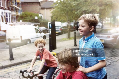 Boys Playing Outside In The Park High Res Stock Photo Getty Images