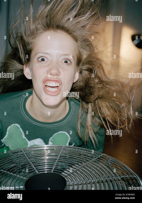 A Woman Making A Crazy Face Above A Fan Stock Photo Alamy