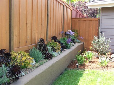 Building a raised garden bed | madness & method. fence with raised planter | Garden ideas | Pinterest ...