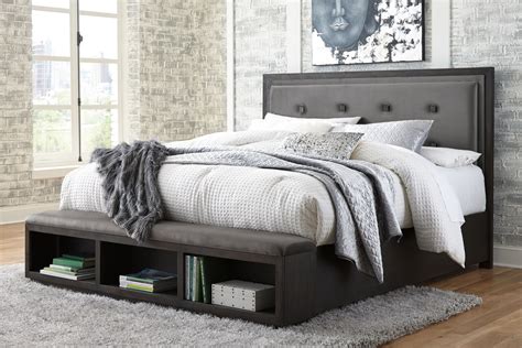Hyndell Dark Brown California King Upholstered Panel Bed With Storage