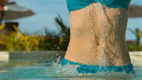 Close Up Young Caucasian Woman In Bikini Jumps Out Of