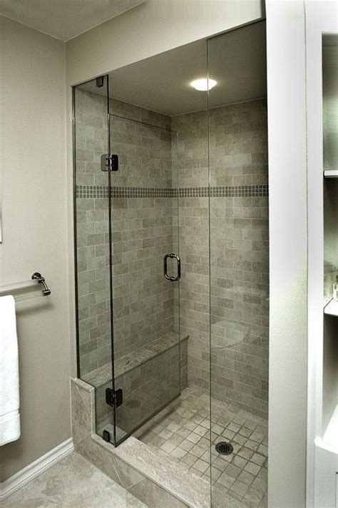 Covering the shower walls are two different types of tile: Shower Stalls for Small Bathroom Tile - GooDSGN