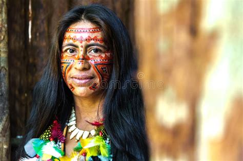Native Brazilian Woman At An Indigenous Tribe In The Amazon Stock Photo