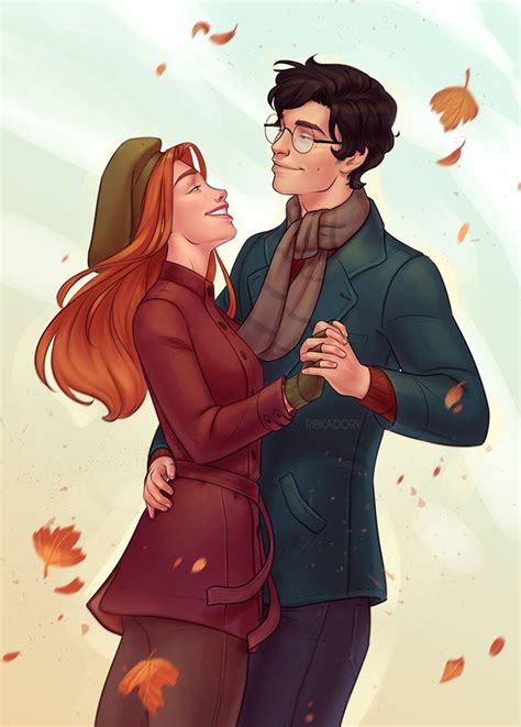 A Man And Woman Standing Next To Each Other With Autumn Leaves Falling On The Ground