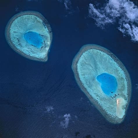 These Two Circular Coral Reefs Each Surrounding A Lagoon Belong To The