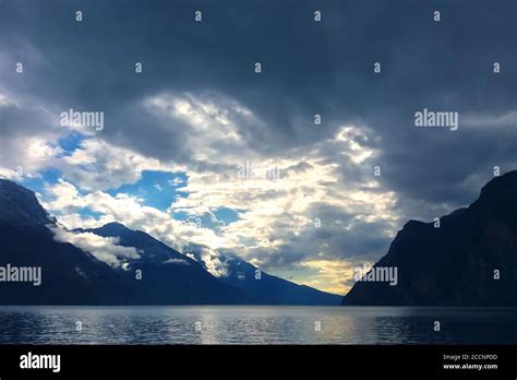Mountain Lake With Dramatic Clouds In Stormy Sky At Blue Twilight Stock