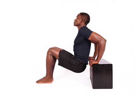 Athletic Man Doing Triceps Bench Dips Exercise