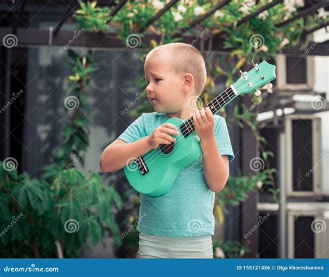 Portrait Of A Cute Boy With Ukulele Stock Photo Image Of Classical