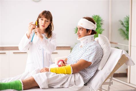 The Young Doctor Examining Injured Patient Stock Image Image Of Hand