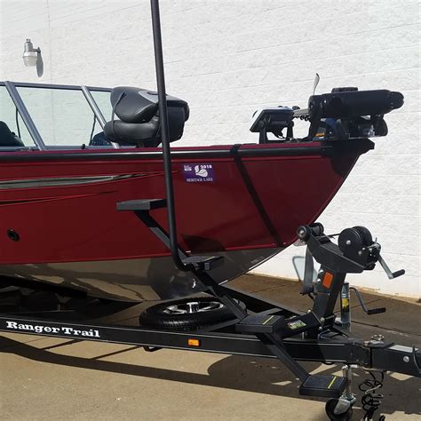 A boat ladder attached to a trailer for easy access to a bow of a boat. 2018 Ranger VS - Trick Step Marine Trailer Steps
