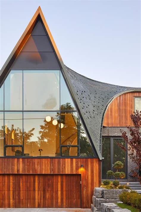 A Curved Roof Covered In Diamond Shaped Zinc Shingles Adds A Creative